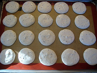 macaron batter piped onto a silpat