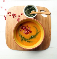 butternut squash soup with cilantro pesto and pomegranate seeds