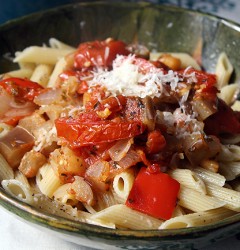 a bowl of pasta with ratatouille and parmesan